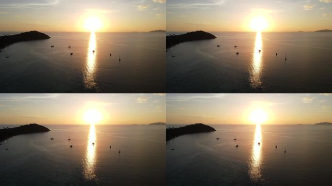 鸟瞰日落在海洋与渔船的剪影，利比岛，沙卡通，泰国