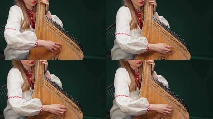 一名妇女正在演奏古老的乌克兰传统弦乐器班杜拉或kobza