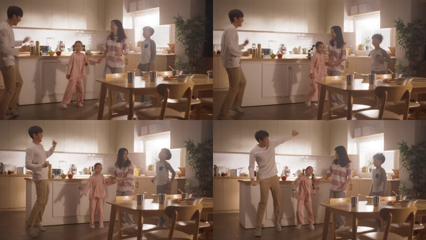 快乐回忆:韩国小家庭开心，早上在厨房里随着著名的流行音乐跳舞。年轻的父母和两个孩子在家里享受周末