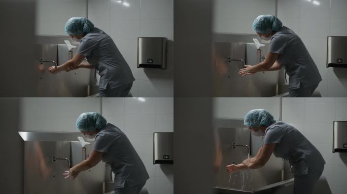 穿着制服的专业女外科医生在手术前清洁双手