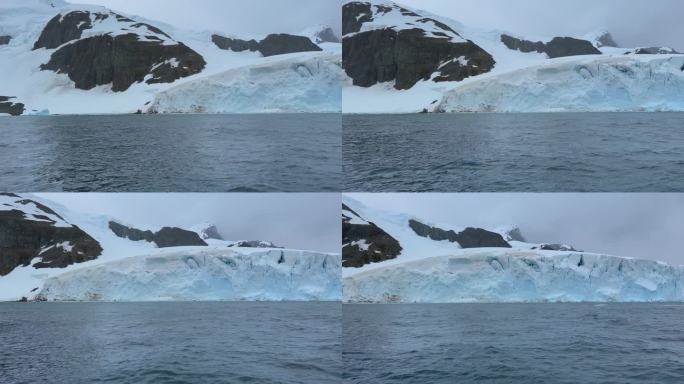 南极海船经过冰川和浮冰