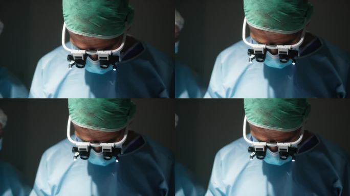 心脏外科医生用手术头灯在心脏支架上操作