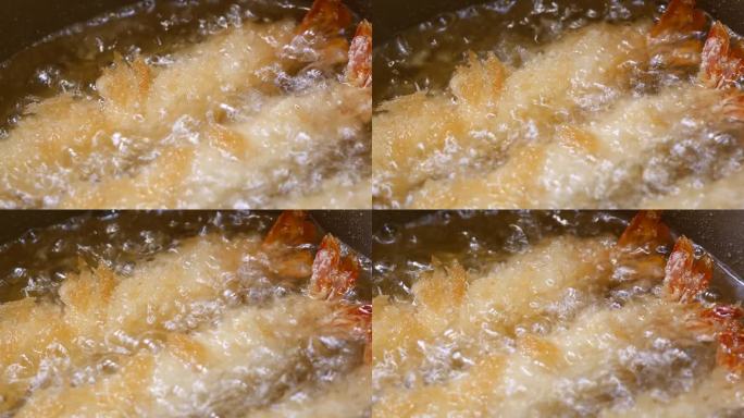 炸虾裹上炸过的生面包屑。特写镜头。从左到右。