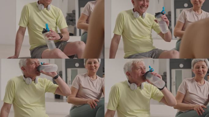 老人在集体健身后与教练聊天喝水