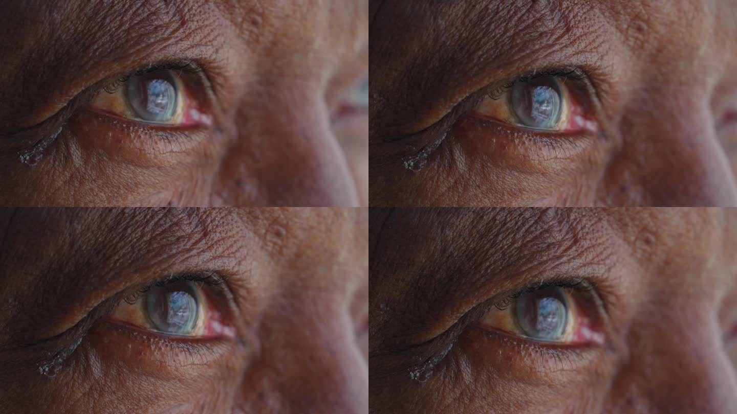 非洲裔美国人的眼睛宏观特写。一个黑人老人睁开了蓝色的眼睛