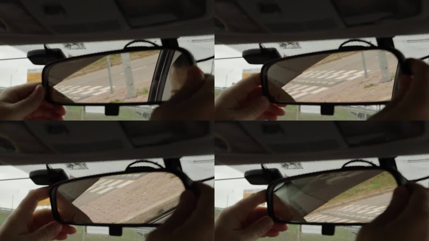 一名男子正在车内微调后视镜，花点时间仔细仔细地进行驾驶前检查