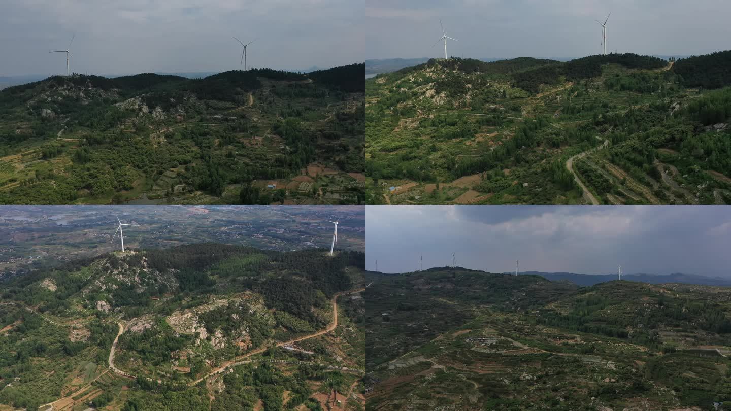 航拍大山中的风力发电机 山峰连绵