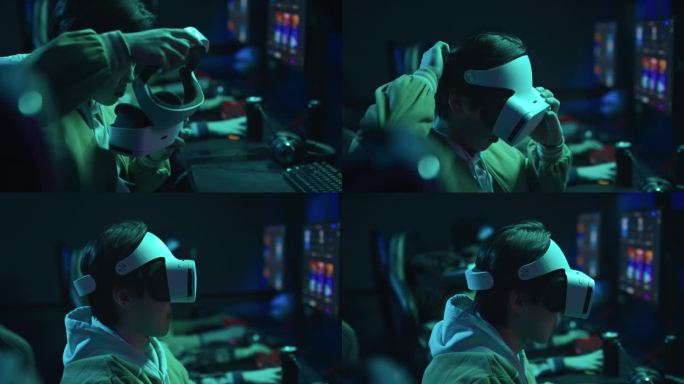 亚洲男子在网吧戴上AR头显玩电子游戏