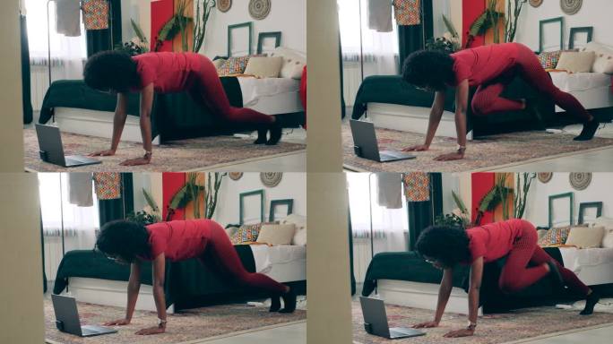 一位非洲女士在自我隔离期间进行健身训练