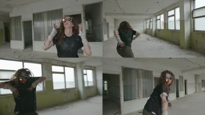 有创意的女人戴着VR眼镜在废弃的建筑里跳舞。年轻的女舞者，头发凌乱，戴着垃圾VR眼镜，在废弃建筑的走