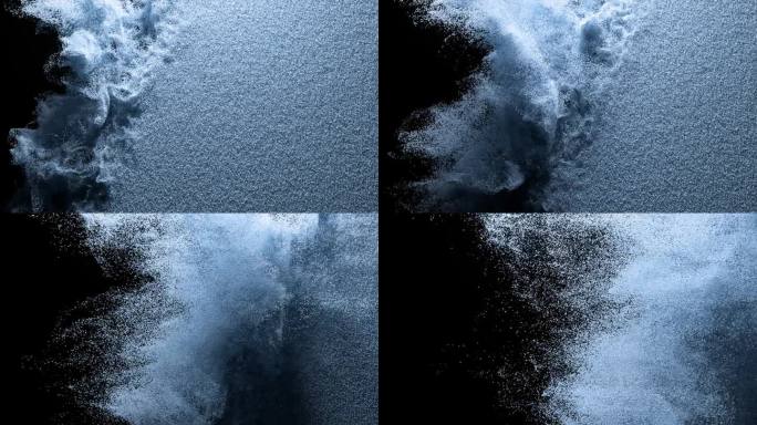 抽象的概念。彩色粉末散落在黑色孤立的背景上。沙子。喷雾。蓝色的颜色。缓慢的运动。