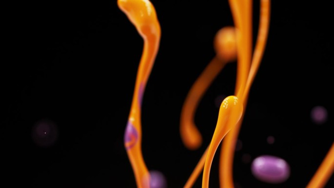 橙色和紫色的油漆飞溅，形成水滴。抽象的背景