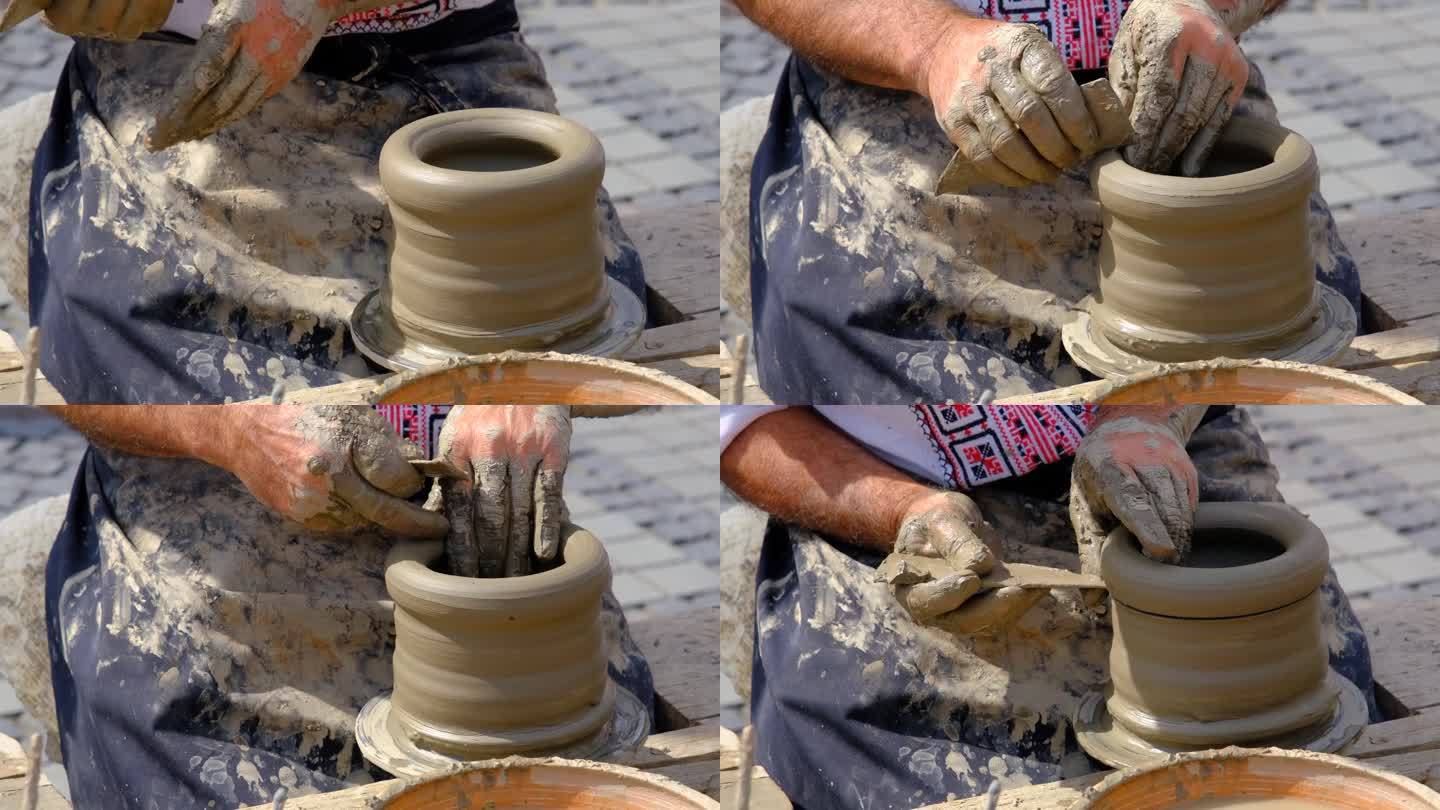 老陶工在陶轮上制作陶罐