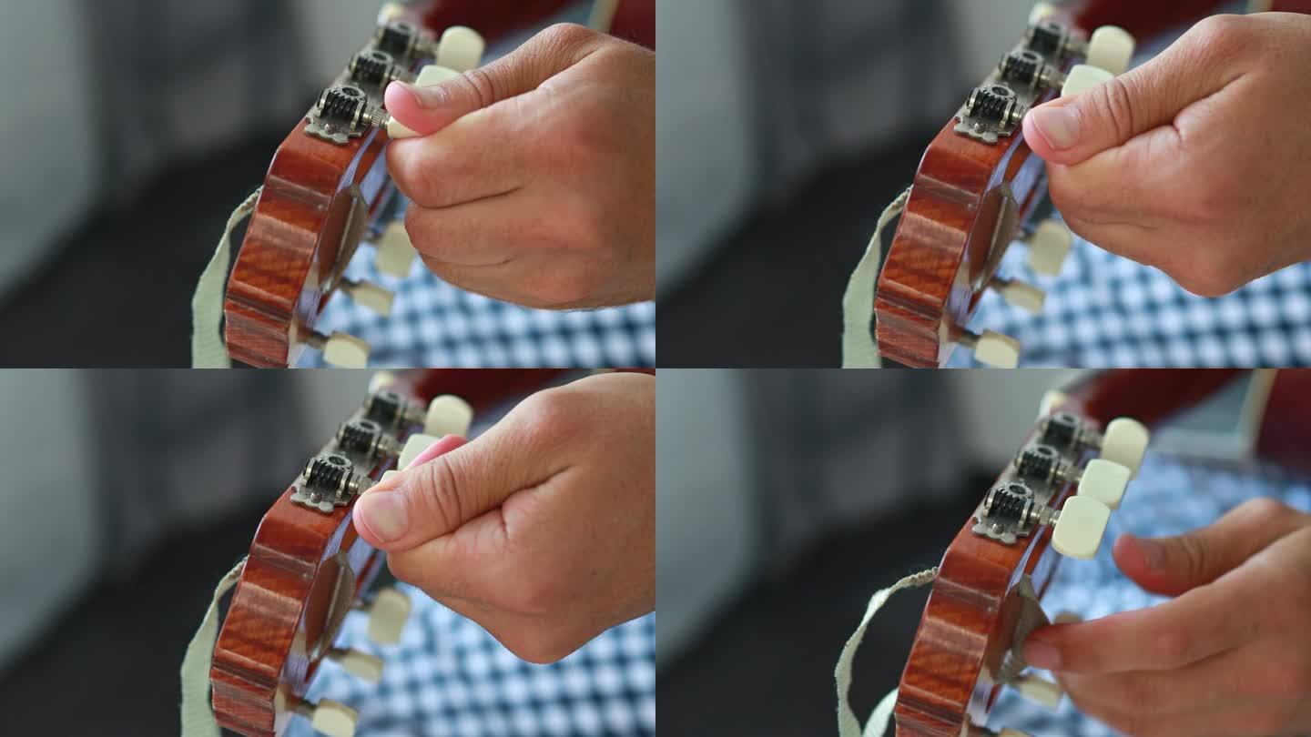 一个男人用手调吉他的特写镜头。