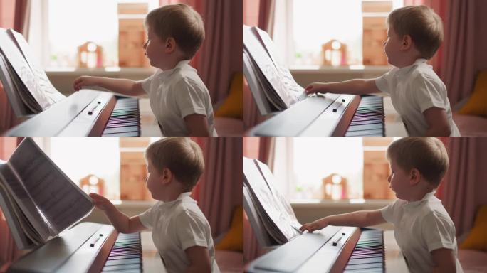 聪明的男孩坐在电子钢琴前翻乐谱