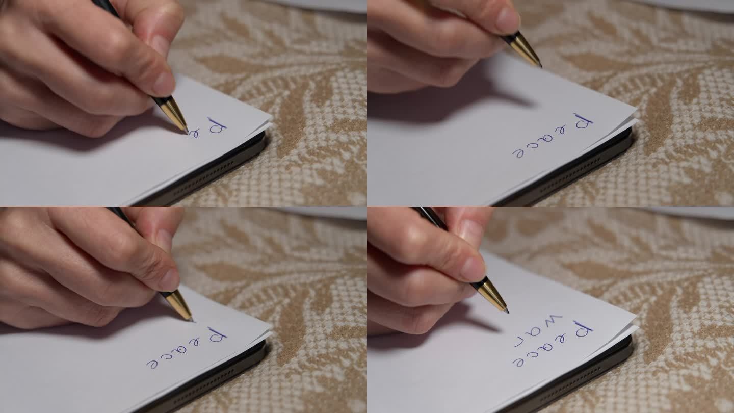 特写女性用蓝笔在白纸上书写和平战争爱情。特写:无法辨认的白人女性在室内写字。