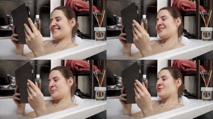 女人一边洗澡一边用平板电脑和朋友或家人视频聊天。我们平衡个人护理和社会互动的现代方式