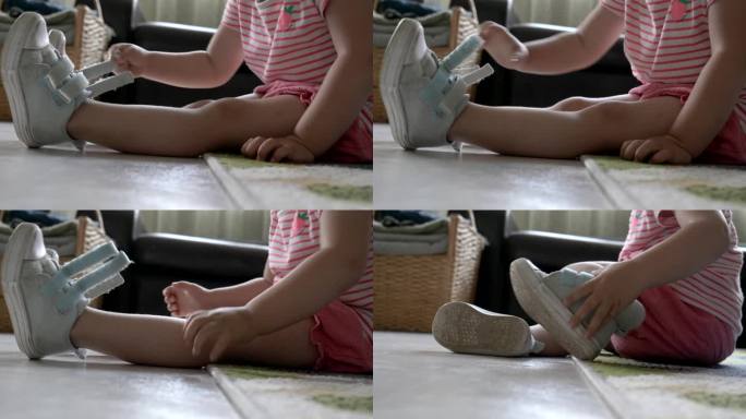 孩子学会穿鞋和脱鞋。