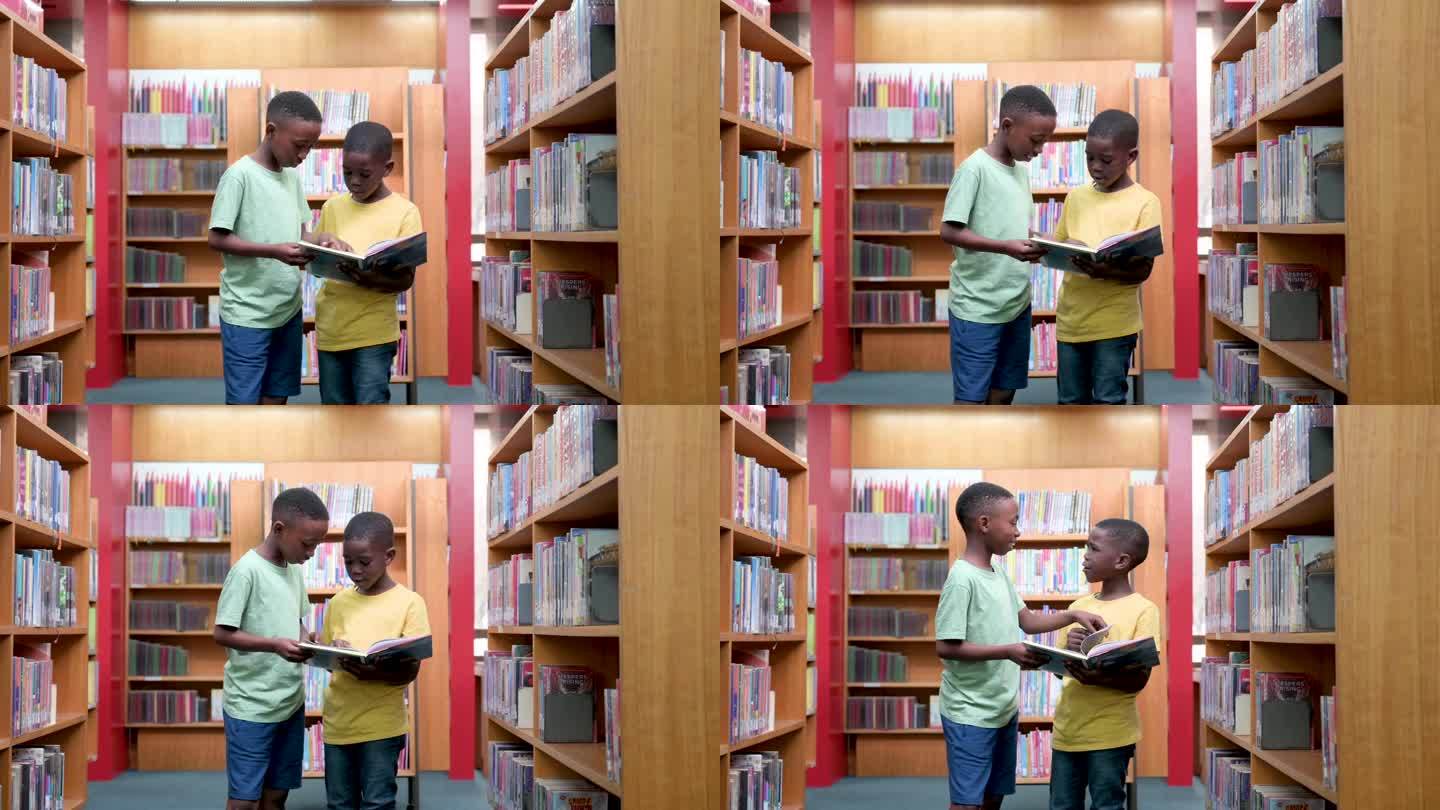 男孩子们在图书馆里站在一起看书