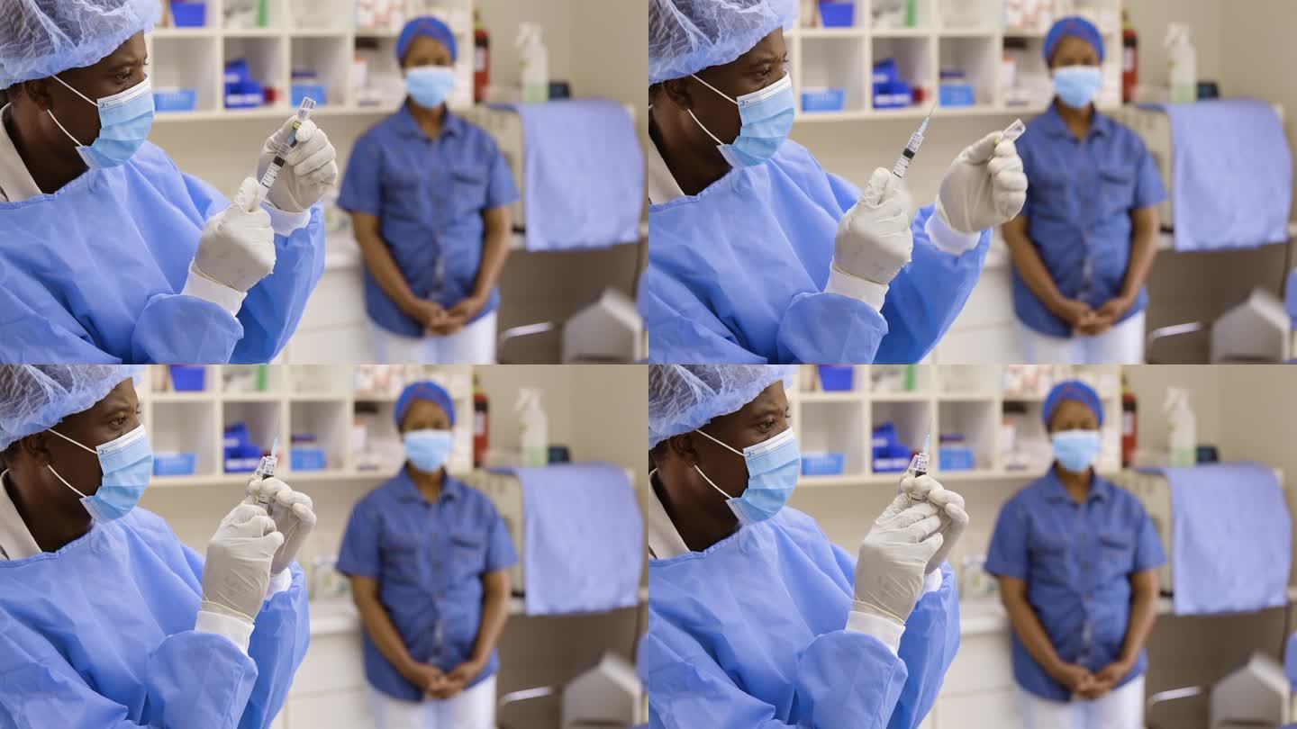 非洲黑人男医生护士在医生的房间里从小瓶中抽取液体进行注射