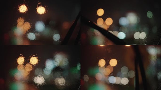 晚上在雨中开车。汽车玻璃雨刮器夜景