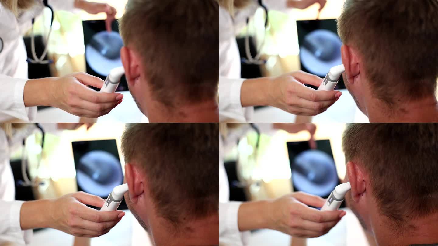耳鼻喉科医生用数码耳镜检查病人的耳朵