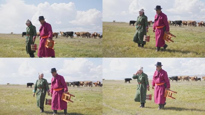 幸福的蒙古夫妇挤完牛奶走回蒙古包