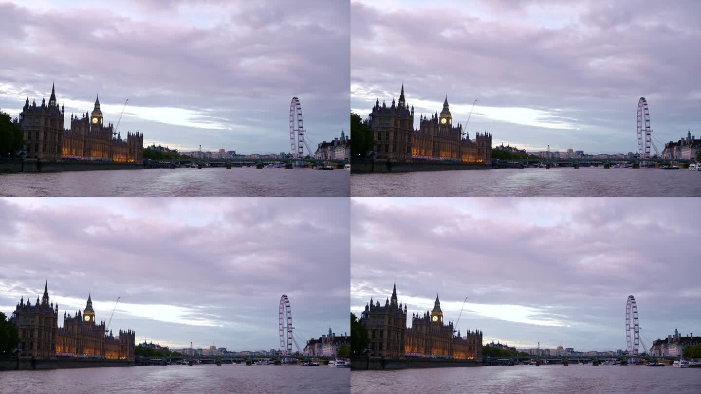 日落时分，从泰晤士河上漂浮的船上俯瞰伦敦，英国。威斯敏斯特宫、伊丽莎白塔和伦敦眼