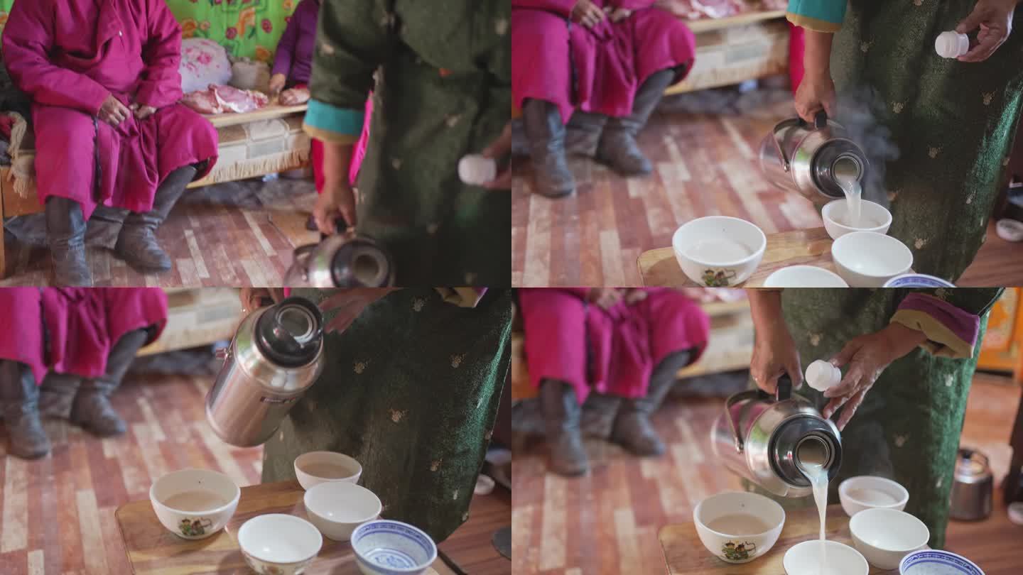 蒙古包里的蒙古妇女为她的丈夫和客人倒奶茶