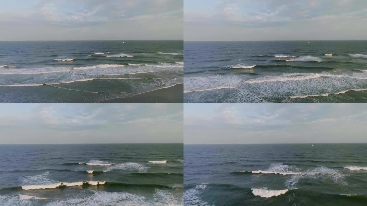 无人机拍摄的海滩和大西洋海浪，朦胧的日出在美国布里甘特