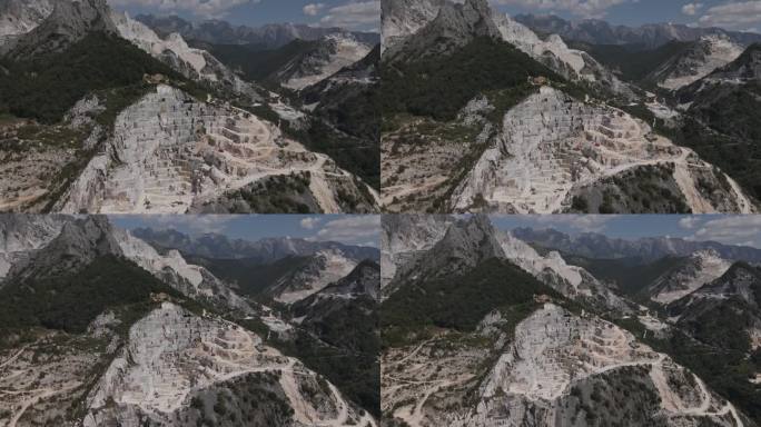 拉回无人机镜头，描绘了意大利托斯卡纳卡拉拉无数的大理石采石场。这种昂贵的白石以其在文艺复兴时期艺术和