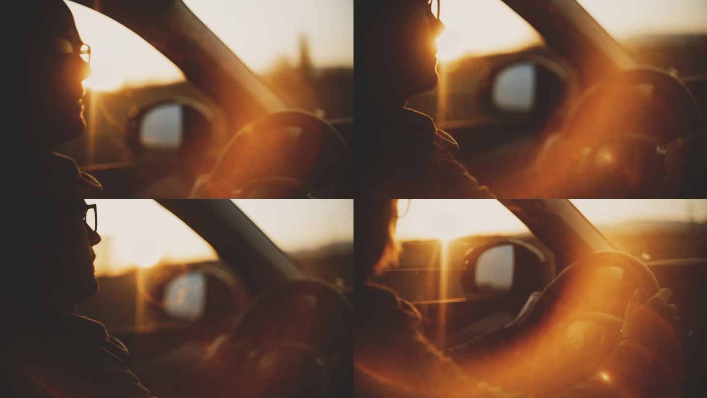 慢镜头:夕阳下开车的人的剪影