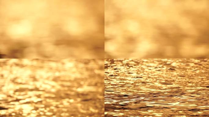 模糊的金色大海在日落与移动焦点和散景效果。太阳反射着波光，照亮了金色的大海。假日休闲概念。抽象航海夏