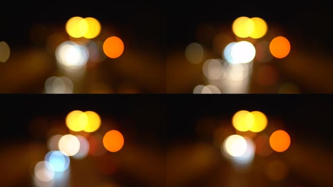 夜间交通中汽车明亮模糊的灯光。背景。