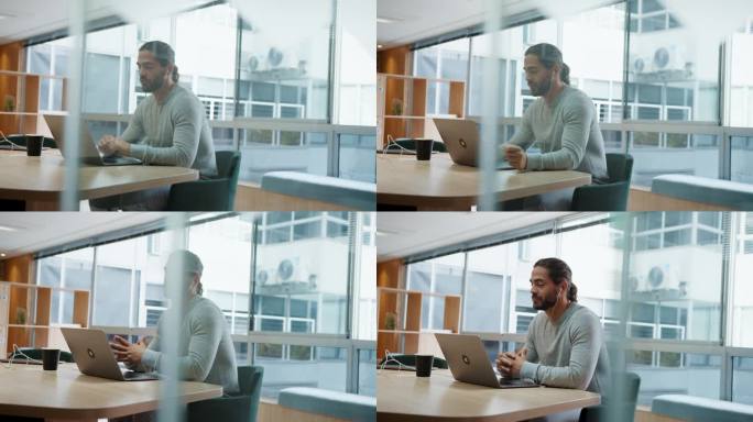 商务人士使用笔记本电脑进行虚拟会议，在共同办公空间与同事交流
