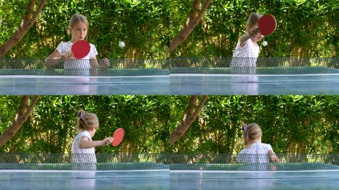 快乐的女孩在绿色的背景上打乒乓球