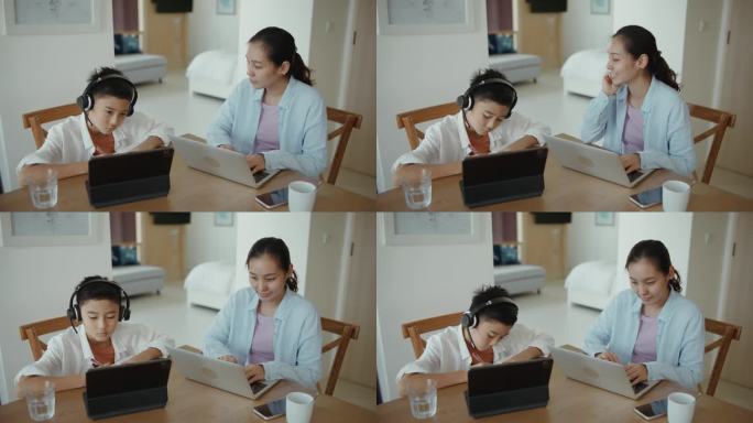 男孩在家和妈妈一起上网络课