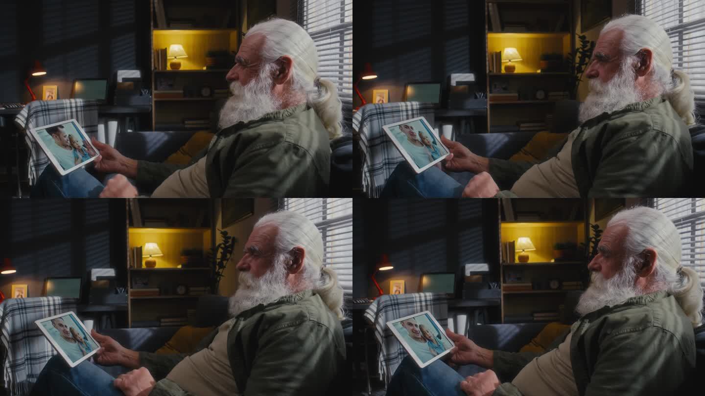 老人拿着平板电脑和儿子孙女聊天