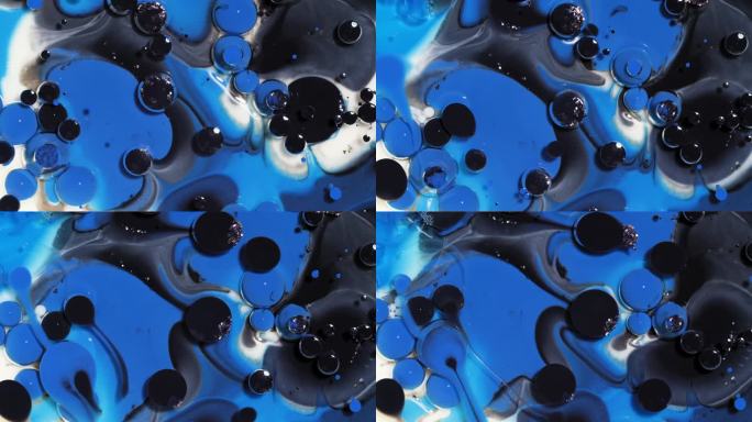 白色、蓝色和黑色的抽象派艺术背景，墨水泡沫破裂和反应