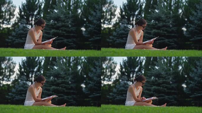在草地上休息的女人。读一本书