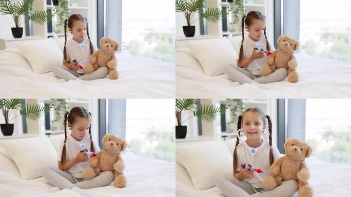 微笑的女孩用床上的玩具注射器给泰迪熊注射疫苗