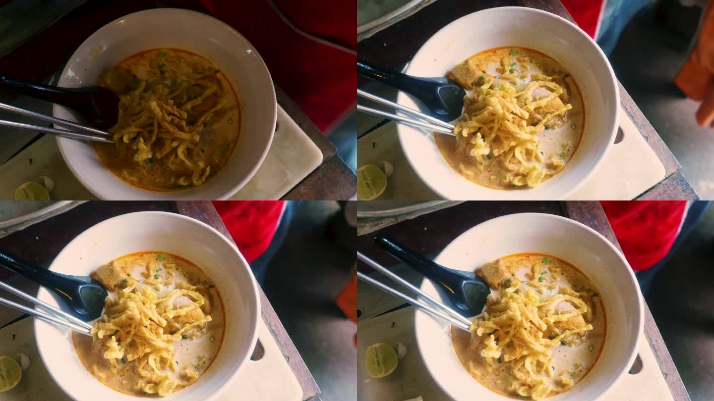 在泰国的一家餐馆里，一种叫做Khao Soi的传统泰国菜的4K电影烹饪镜头