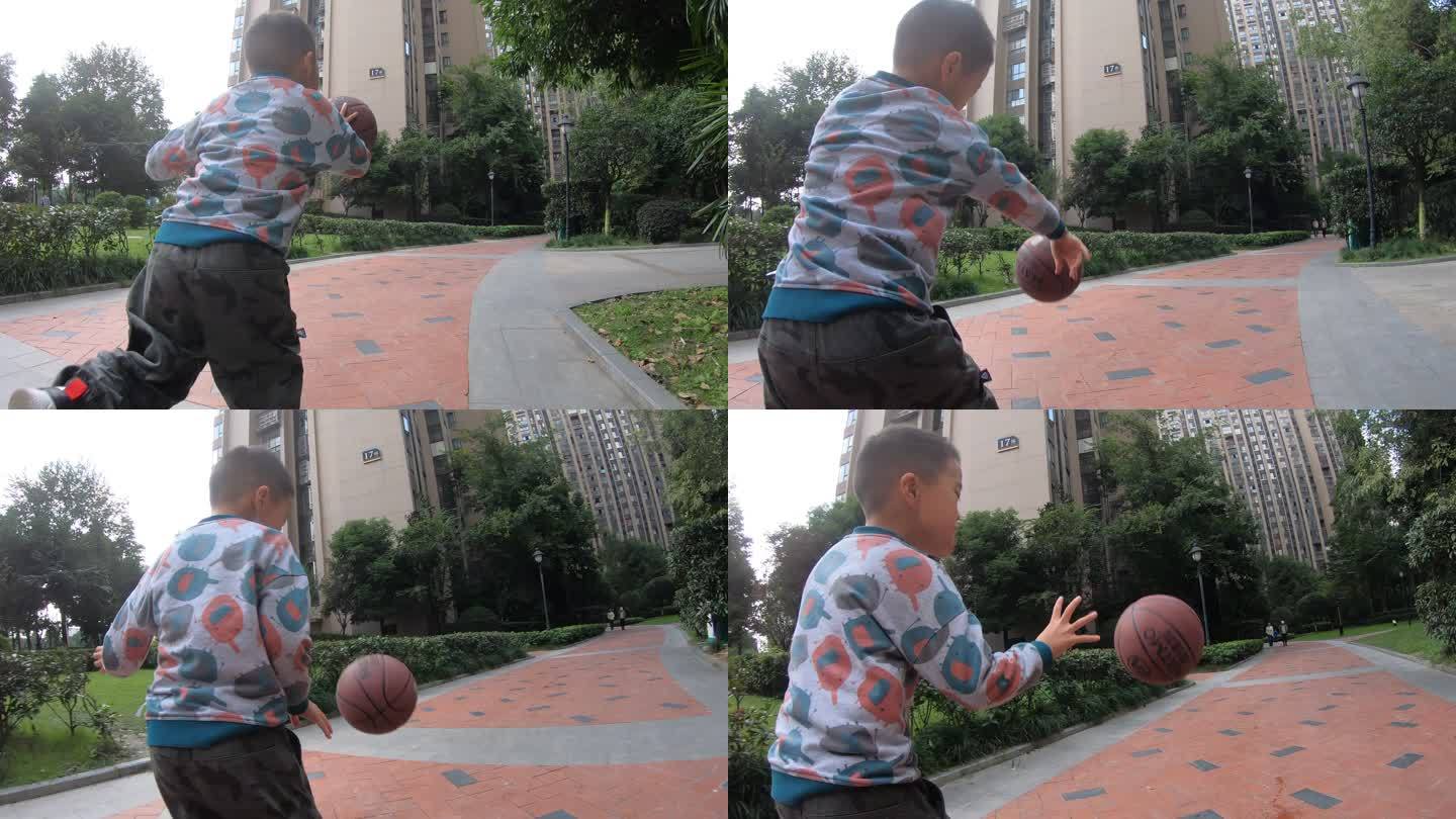 小男孩正在学习打篮球