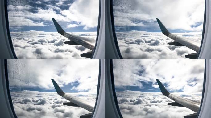 从飞机窗口俯瞰云层 飞机天空云彩