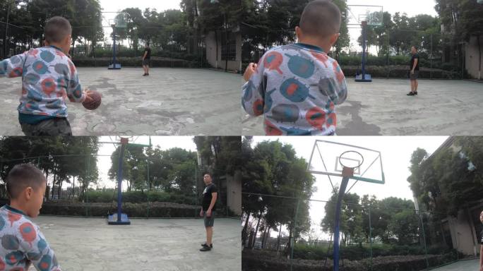 小男孩正在学习打篮球