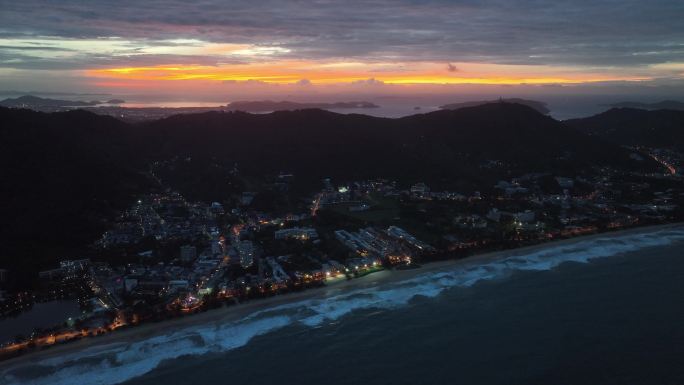 航拍泰国普吉岛卡伦海滩地区城镇日出风光