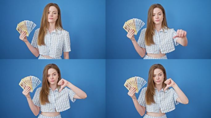 年轻的金发女子手持匈牙利福林钞票，在孤立的蓝色背景上做拇指向下的手势