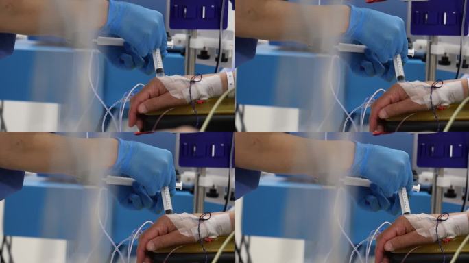 护士给病人输液的4K特写镜头。病人包扎的手和护士的手在发光股票视频中看到。
