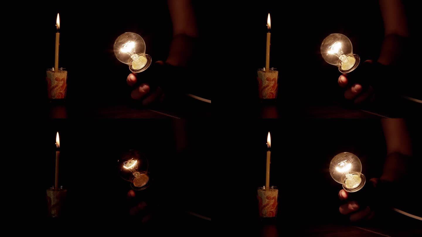 手拿一个闪烁的灯泡在黑暗的房间里，背景是燃烧的蜡烛