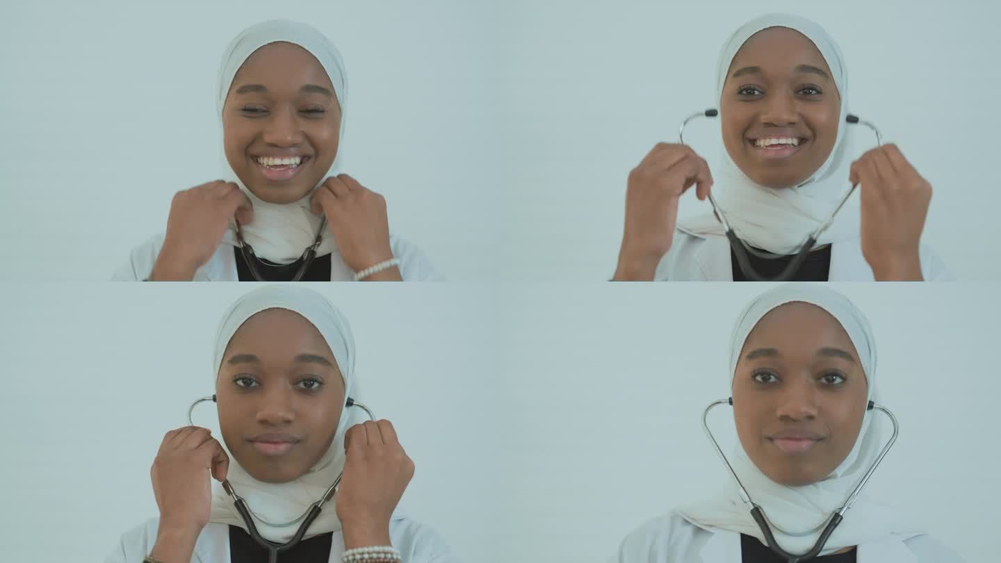 美丽迷人的穆斯林医生用听诊器为女青年诊察病人。